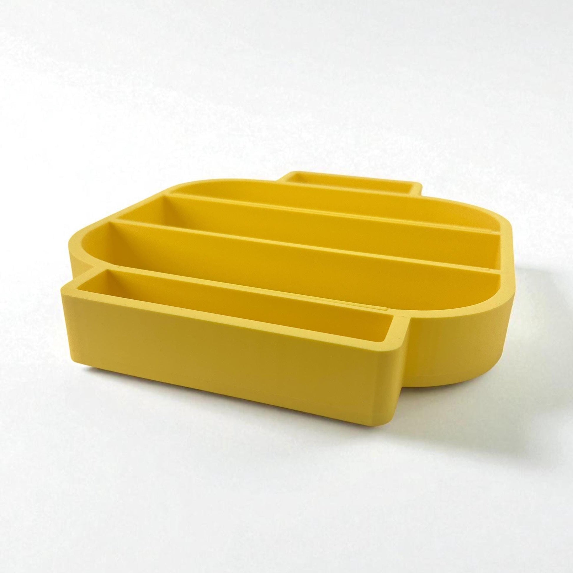 Angled perspective of yellow LEGO-inspired display shelf showing depth and inner compartments